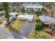 Aerial view showing the property's layout, including the house, driveway, and surrounding landscaping and neighborhood at 1220 George St, Winter Springs, FL 32708