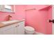 Bathroom featuring pink paint and vanity with a white sink and bronze faucet at 1220 George St, Winter Springs, FL 32708