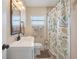 Bathroom featuring neutral paint, decorative shower curtain, and bronze fixtures at 1220 George St, Winter Springs, FL 32708