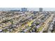 An aerial view of a beachfront community with a bright green house and a yellow arrow pointing towards it at 38 Seaside Dr, Ormond Beach, FL 32176