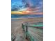 A beautiful beach sunset with dramatic orange and blue clouds over a calm ocean at 38 Seaside Dr, Ormond Beach, FL 32176