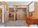 Bedroom showcasing wood paneled walls and closet with organizer at 38 Seaside Dr, Ormond Beach, FL 32176