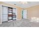 Bedroom boasting gray carpet and closet with shelving for optimized storage solutions at 38 Seaside Dr, Ormond Beach, FL 32176