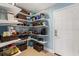 Organized walk-in pantry features ample shelving for storage and a clean, efficient design at 4101 Poinciana Dr, Indian Lake Estates, FL 33855