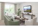 A view of a sunlit living room featuring a large window, neutral decor and stylish furnishings at 5896 Meditation Dr, Clermont, FL 34714