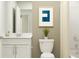 Bright bathroom with a modern vanity, framed mirror, toilet and shower/tub at 946 Hour Glass Rd, Lakeland, FL 33801