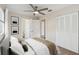 Cozy bedroom featuring ample closet space, neutral color palette, and access to an ensuite bathroom at 1422 Connestee Rd, Lakeland, FL 33805