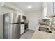 Well-equipped kitchen with modern appliances, a sleek sink, and ample counter space with white cabinets at 1422 Connestee Rd, Lakeland, FL 33805