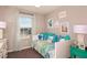 Cozy bedroom with daybed, charming decor, and window view at 2513 Penguin Blvd, Davenport, FL 33837