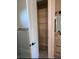 A bathroom closet with adjustable wire shelves for efficient storage and organization at 562 Dowling Cir, Lady Lake, FL 32159