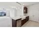 Bright, open kitchen with a farmhouse sink, stainless steel dishwasher, and modern pendant lights at 6973 Wilson Pasture Ave, Groveland, FL 34736