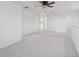 Spacious carpeted loft with a ceiling fan and neutral walls at 6973 Wilson Pasture Ave, Groveland, FL 34736