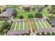 Aerial view of bocce ball courts in lushly landscaped recreation area with other athletic fields nearby at 8291 Sw 54Th Loop, Ocala, FL 34481