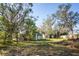 Expansive backyard with multiple storage sheds, offering ample space for gardening and outdoor activities at 6317 Georgia Ave, Lakeland, FL 33813