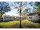 Large backyard with a detached storage shed, providing ample space and functionality for outdoor activities at 6317 Georgia Ave, Lakeland, FL 33813