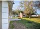 Backyard view showing a detached storage shed with trees, enhancing the property's functionality and outdoor appeal at 6317 Georgia Ave, Lakeland, FL 33813