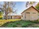 Back exterior view showing a detached storage shed, adding to the property's functional and outdoor appeal at 6317 Georgia Ave, Lakeland, FL 33813