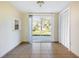 Bright dining room with sliding glass door to backyard and closet for storage at 6317 Georgia Ave, Lakeland, FL 33813