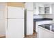 Kitchen featuring white refrigerator, cabinets, and countertops at 6317 Georgia Ave, Lakeland, FL 33813