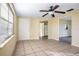 Bright living room with tile flooring and ceiling fan at 6317 Georgia Ave, Lakeland, FL 33813