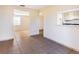 Living room featuring tile floors, beige walls and multiple passageways at 6317 Georgia Ave, Lakeland, FL 33813