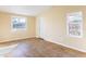 Room featuring beige walls and tile floors with multiple windows at 6317 Georgia Ave, Lakeland, FL 33813