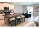 Contemporary kitchen featuring a granite island with seating and stainless steel appliances at 2206 Old Mining Rd, Lakeland, FL 33801