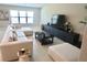 Stylish living room showcasing a large sectional sofa, sleek entertainment center, and a large window at 2206 Old Mining Rd, Lakeland, FL 33801