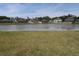 View of a pond in a neighborhood at 2206 Old Mining Rd, Lakeland, FL 33801