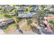 An aerial view of a house in a neighborhood with a driveway and mature trees in the front yard at 3603 Royal S Ct, Lakeland, FL 33812