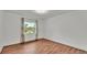 Bright bedroom with beautiful floors and a large window letting in natural light at 3603 Royal S Ct, Lakeland, FL 33812