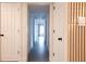 Hallway features wood accent wall and luxury vinyl flooring with a view to the exterior at 1231 Sidcup Rd, Maitland, FL 32751