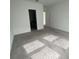 Bright bedroom with plush carpeting, abundant natural light, and neutral decor at 145 Andreas St, Winter Haven, FL 33881