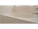 Clean white soaking bathtub under a bright window at 131 Vine Dr, Davenport, FL 33837