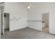 Bedroom with a ceiling fan, neutral carpet, and ensuite bathroom access at 131 Vine Dr, Davenport, FL 33837