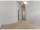 Spacious bedroom featuring neutral carpet, a ceiling fan, and white walls providing a blank canvas at 131 Vine Dr, Davenport, FL 33837