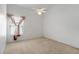 Bedroom with neutral carpet, ceiling fan, window, and white walls providing a blank canvas at 131 Vine Dr, Davenport, FL 33837