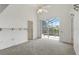 Bedroom featuring neutral carpet and sliding glass doors to the outdoor space at 131 Vine Dr, Davenport, FL 33837