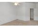 Bedroom features a ceiling fan, neutral carpet, and white walls providing a blank canvas at 131 Vine Dr, Davenport, FL 33837