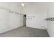 Bedroom with a ceiling fan, neutral carpet, and closet space at 131 Vine Dr, Davenport, FL 33837