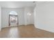 Inviting living room with neutral tile floors, a large window, and ample natural light at 131 Vine Dr, Davenport, FL 33837