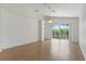 Bright living room with sliding glass doors that lead to the pool area at 131 Vine Dr, Davenport, FL 33837