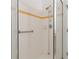 Tiled shower with glass door and hand rails for safety at 131 Vine Dr, Davenport, FL 33837