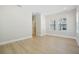 Bright bedroom with light wood floors and ample natural light from the double windows at 2304 Depauw Ave, Orlando, FL 32804