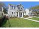 Charming two-story home with well-manicured lawn, covered porch, and craftsman style architecture at 2304 Depauw Ave, Orlando, FL 32804