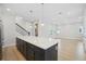 Bright kitchen with a large island that opens to the living room and stairwell at 2304 Depauw Ave, Orlando, FL 32804
