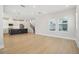 Open floorplan showcasing the modern kitchen, staircase, and abundant natural light at 2304 Depauw Ave, Orlando, FL 32804