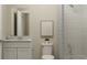 Clean bathroom features a shower-tub combo, modern fixtures, and tiled walls at 2614 Skyline Loop, Kissimmee, FL 34758