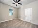 Comfortable bedroom with plush carpeting and a window offering natural light at 7709 Somersworth Dr, Kissimmee, FL 34747