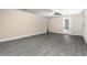 Spacious living room with durable flooring, neutral paint, and a ceiling fan at 7709 Somersworth Dr, Kissimmee, FL 34747